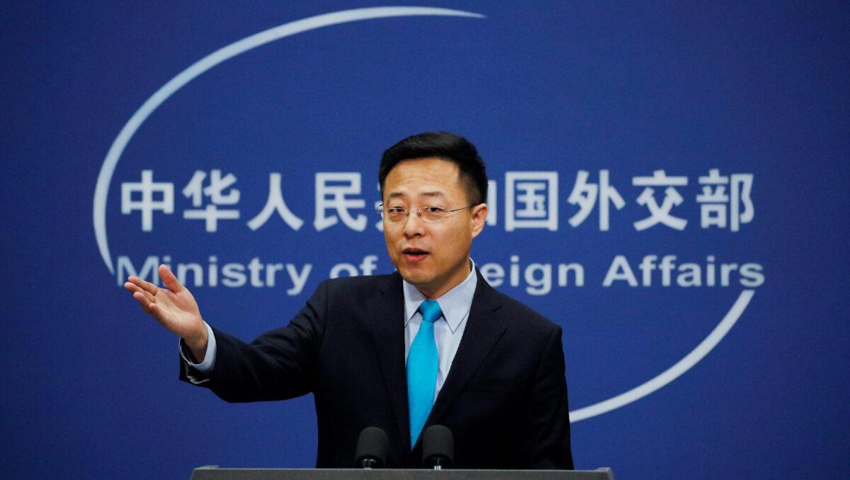 Chinese Foreign Ministry spokesman Zhao Lijian gestures as he speaks during a daily briefing at his ministry in Beijing, on Feb. 24, 2020. (Andy Wong/AP Photo)