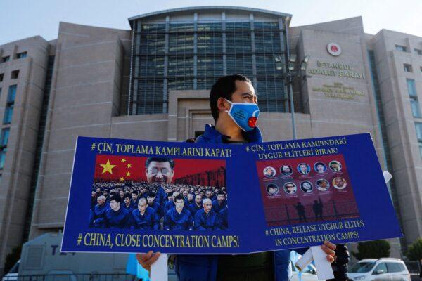 Ethnic Uyghur men take part in a protest against China, in front of the Caglayan Courthouse, in Istanbul, Turkey, on Jan. 4, 2022. (Dilara Senkaya/Reuters)