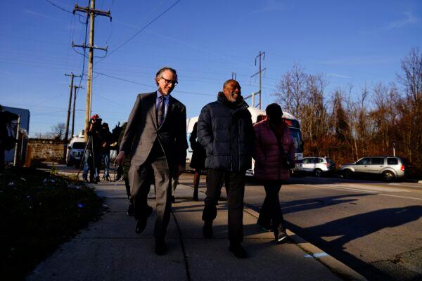 Willie Stokes, center, and lawyer Michael Diamondstein walk in Chester, Pa., on Jan. 4, 2022, after Stokes' 1984 murder conviction was overturned. (Matt Rourke/AP Photo)