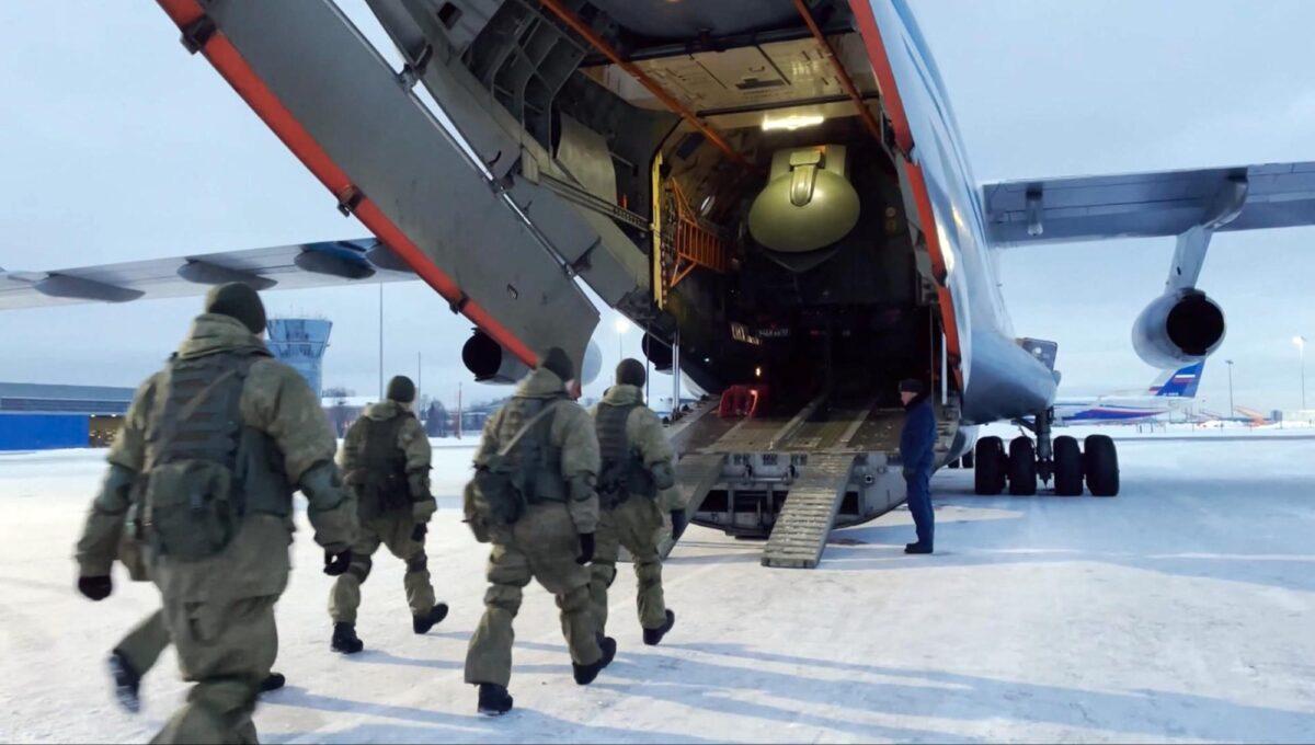 In this photo taken from video released by the Russian Defense Ministry Press Service, Russian peacekeepers board on a Russian military plane at an airfield outside Moscow, in Russia to fly to Kazakhstan on Jan. 6, 2022. (Russian Defense Ministry Press Service via AP)
