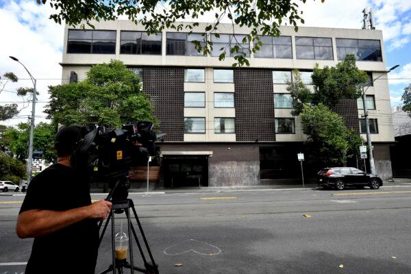 A television cameraman films a hotel where Serbia's Novak Djokovic is believed to be in, in Melbourne, Australia, on Jan. 6, 2022. (Joel Carrett/AAP Image via AP)