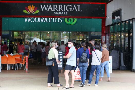 People stand in line outside a Woolworths supermarket in a southern suburb of Brisbane, Australia, on Jan 8, 2021. (Jono Searle/Getty Images)