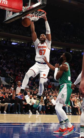 Taj Gibson #67 of the New York Knicks dunks against Jaylen Brown #7 of the Boston Celtics during their game at Madison Square Garden, in New York City, on Jan. 6, 2022. (Al Bello/Getty Images)