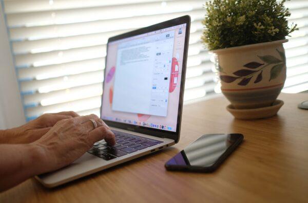 A person works on a laptop from a home office. (Chris Delmas/AFP via Getty Images)