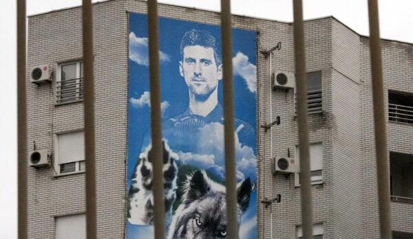 A billboard depicting Serbian tennis player Novak Djokovic hangs on a building in Belgrade, Serbia, on Jan. 6, 2022. (Darko Vojinovic/AP Photo)
