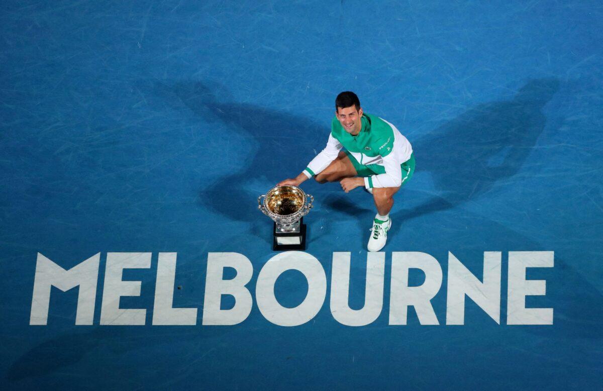 Serbia's Novak Djokovic celebrates with the trophy after winning his final match against Russia's Daniil Medvedev at the Australian Open in Melbourne, Australia, on Feb. 21, 2021. (Kelly Defina/Reuters)