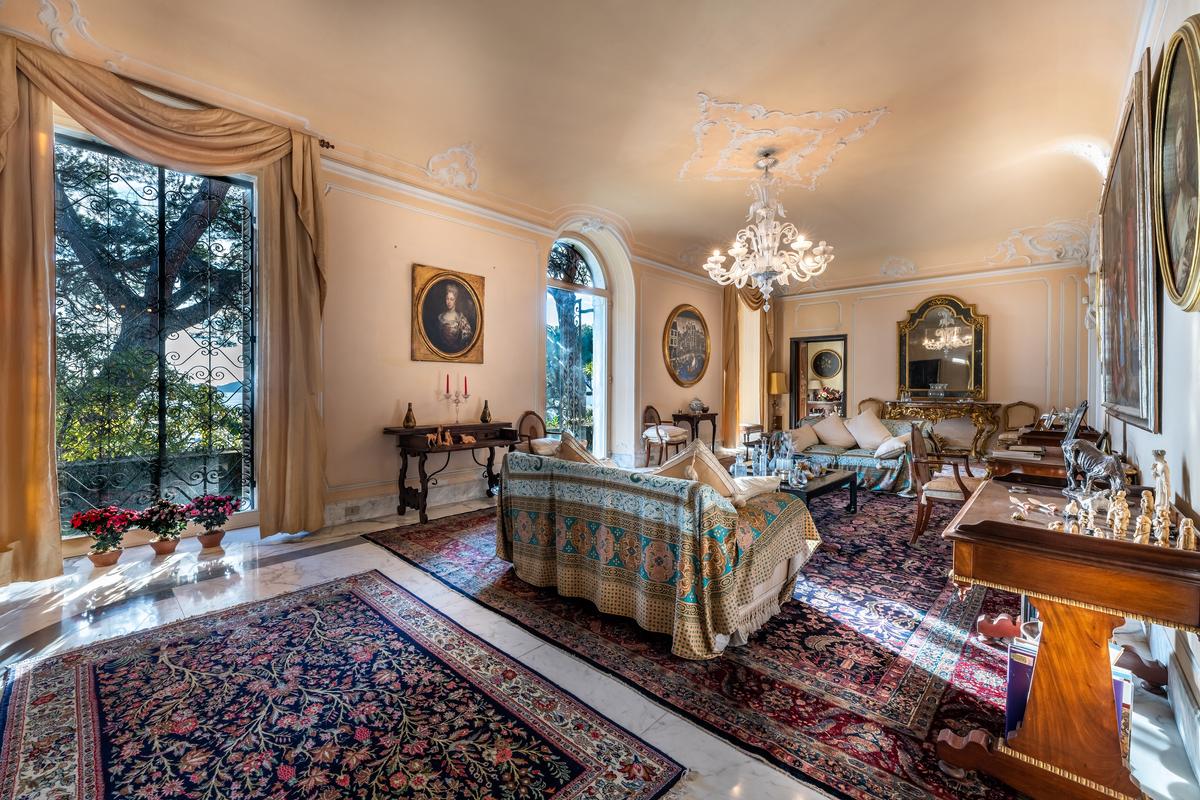 The interiors of the villa feature fine plaster walls, lavish furnishings, and the warmth and charm of period architecture. Most of the rooms open onto terraces or offer views of the Eden-like gardens that surround the residence. (Courtesy of Savills)