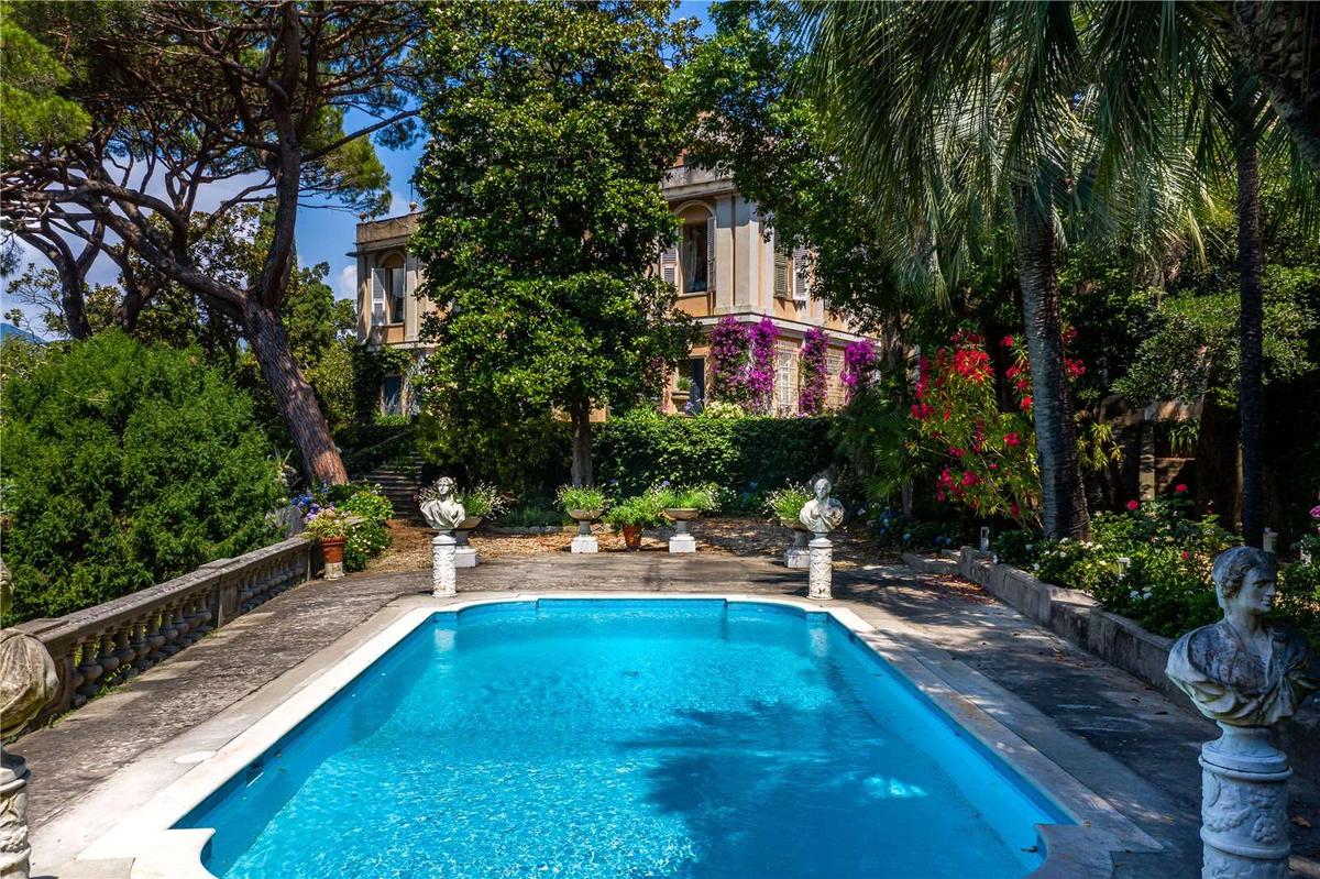 The stunning pool area adds a finishing touch to the grandiose luxury and welcoming charm of this one-of-a-kind property. (Courtesy of Savills)