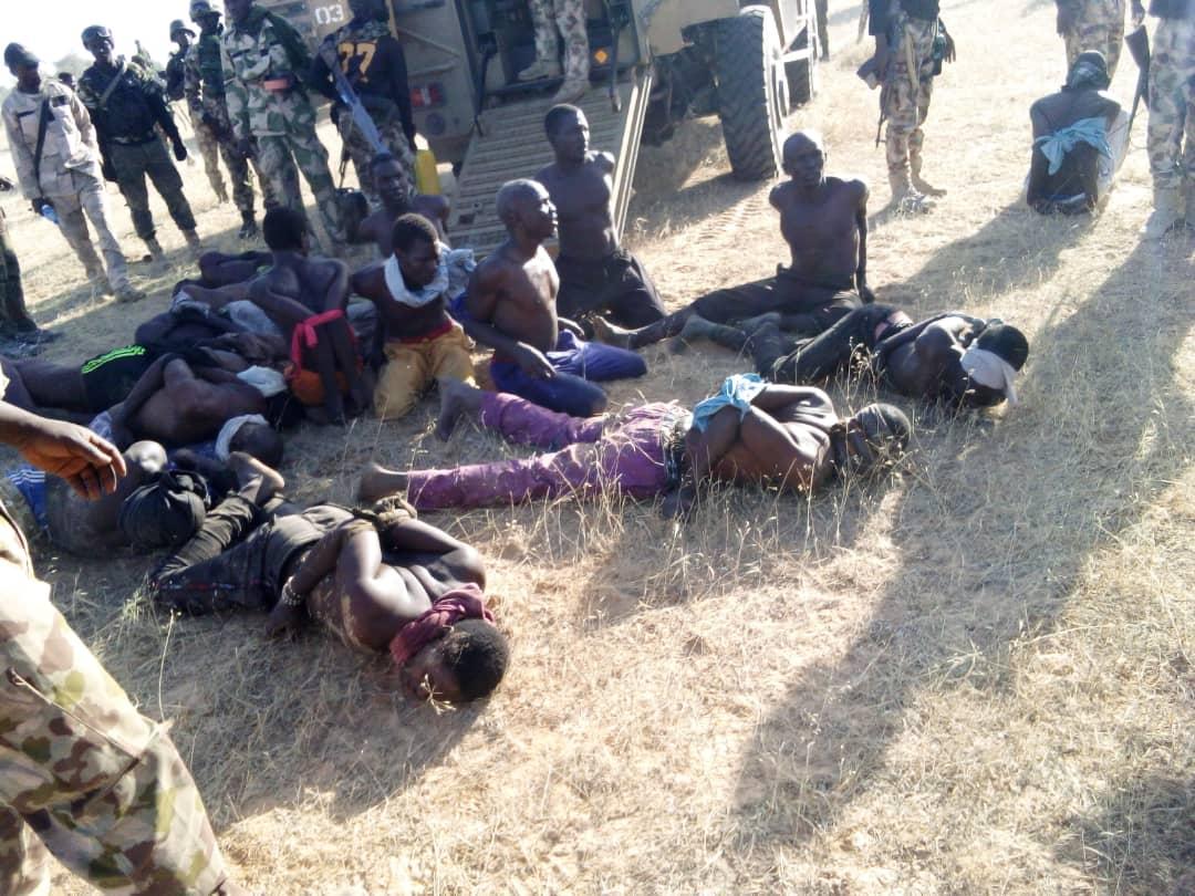 A photo provided by the Multinational Joint Task Force in the region of Lake Chad shows 17 detained Boko Haram terrorists. (MNJTF)