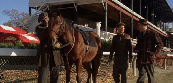 (L–R) Carl M. Craig, Tobey Maguire, and Chris Cooper with racehorse Seabiscuit in "Seabiscuit." (DreamWorks Pictures)