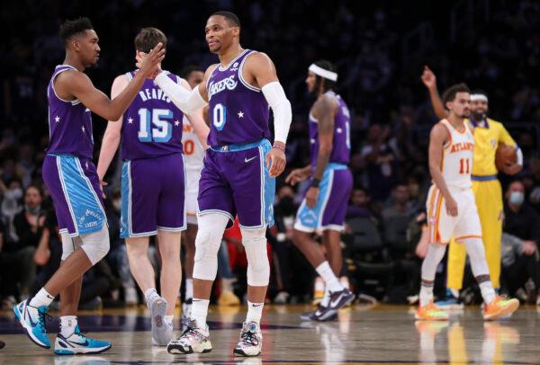 Russell Westbrook #0 of the Los Angeles Lakers celebrates his basket against the Atlanta Hawks with Malik Monk #11 in the first half at Crypto.com Arena, in Los Angeles, on Jan. 7, 2022. (Meg Oliphant/Getty Images)