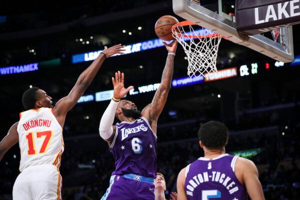 LeBron James #6 of the Los Angeles Lakers drives to the basket defended by Onyeka Okongwu #17 of the Atlanta Hawks in the second half at Crypto.com Arena, in Los Angeles, on Jan. 7, 2022. (Meg Oliphant/Getty Images)