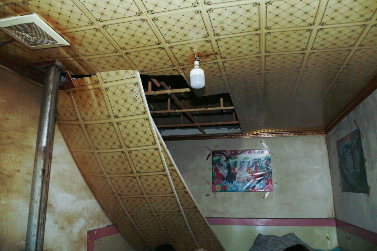 A damaged roof is seen after a 6.6 magnitude earthquake in Menyuan county, in China's northwestern Qinghai Province, on Jan. 8, 2022. (STR/CNS/AFP via Getty Images)