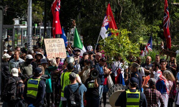 Serbian tennis fans and anti-vaccination protesters rally outside the Park Hotel in Melbourne on Jan. 8, 2022. (Diego Fedele/Getty Images)