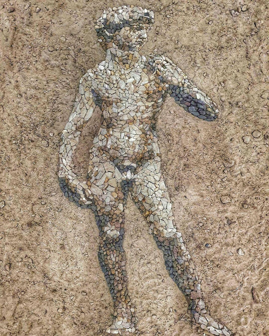 A pebble-painted rendering of Michelangelo's David. (Courtesy of <a href="https://www.facebook.com/justin.bateman1">Justin Bateman</a> and <a href="https://www.instagram.com/pebblepicassos/">@pebblepicassos</a>)