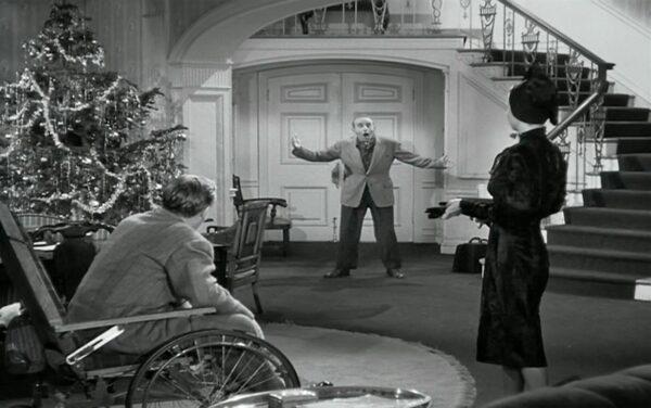 Jimmy Durante (C) stars as one of the surprise guests visiting the Stanleys' home. (Warner Bros.)