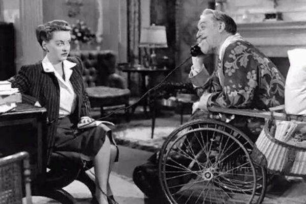 Maggie Cutler (Bette Davis) knows that Sheridan Whiteside (Monty Woolley) is milking his injury for all it’s worth, in “The Man Who Came to Dinner.” (Warner Bros.)