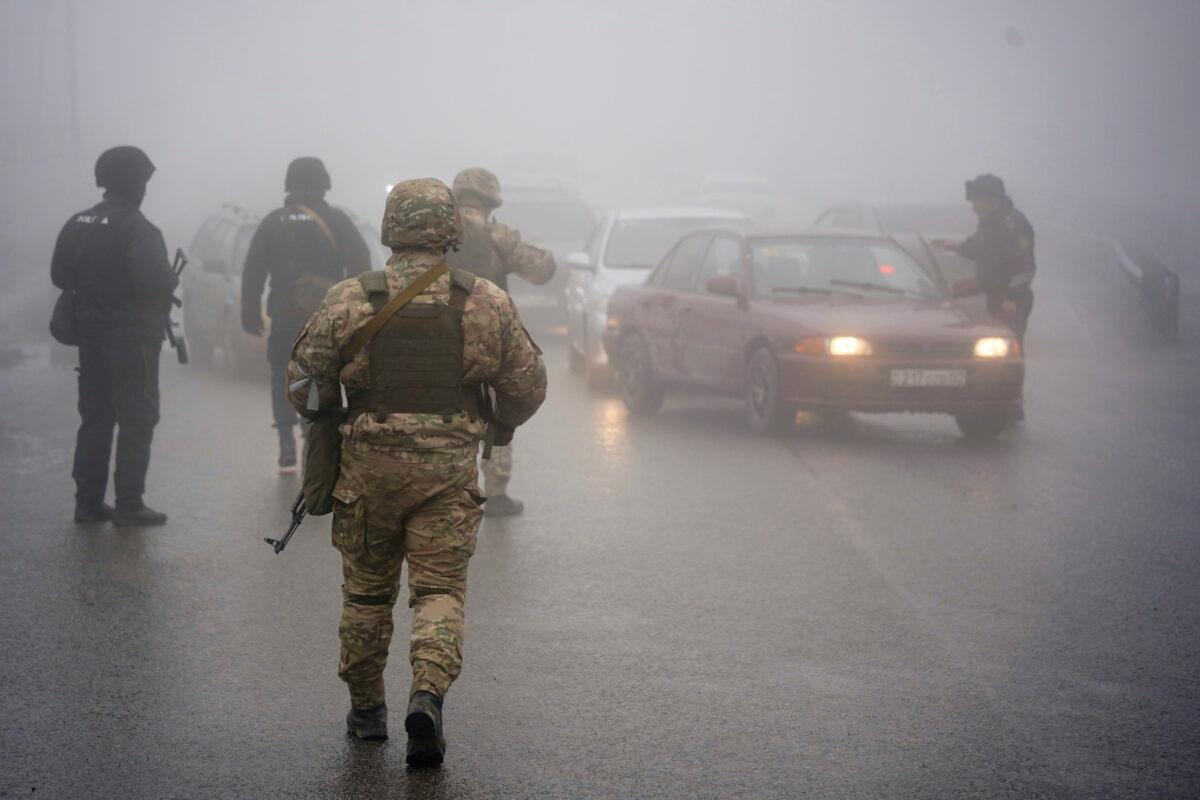 Kazakhstan's soldiers control the road in Almaty, Kazakhstan, on Jan. 8, 2022. (Vladimir Tretyakov/NUR.KZ via AP)
