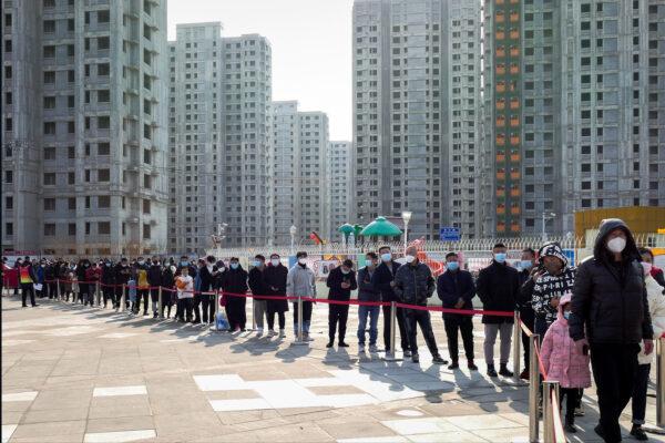 Residents line up for the coronavirus test during citywide mass testing in Tianjin, China, on Jan. 9, 2022. (Chinatopix Via AP)
