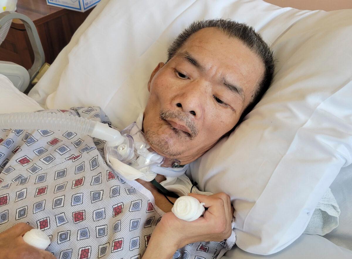 Chinese immigrant Yao Pan Ma in the hospital on Oct. 27, 2021, after he was attacked in April while collecting cans in the East Harlem neighborhood in New York. (Karlin Chan via AP)