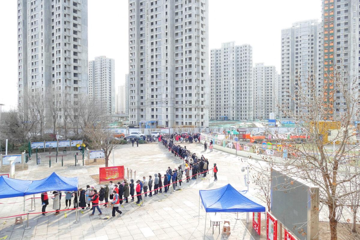 People line up for nucleic acid testing during citywide mass testing for COVID-19 in Tianjin, China, on Jan. 9, 2022. (CNS photo via Reuters)