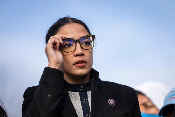 Rep. Alexandria Ocasio-Cortez (D-N.Y.) prepares to speak during a rally outside the U.S. Capitol in Washington, D.C., on Dec. 7, 2021. (Drew Angerer/Getty Images)
