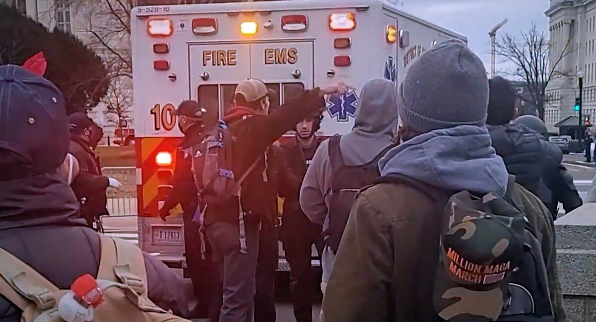 An ambulance rushes a mortally wounded Ashli Babbitt to the hospital after being shot outside the Speaker's Lobby at the U.S. Capitol on Jan. 6, 2021. (CapitolPunishmentTheMovie.com/Bark at the Hole Productions)