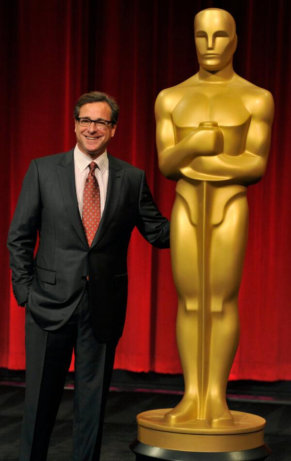 Host Bob Saget poses alongside an Oscar statue before the Academy of Motion Picture Arts and Sciences 40th Student Academy Awards at the Samuel Goldwyn Theater in Beverly Hills, Calif., on June 8, 2013. (Chris Pizzello/Invision/AP)