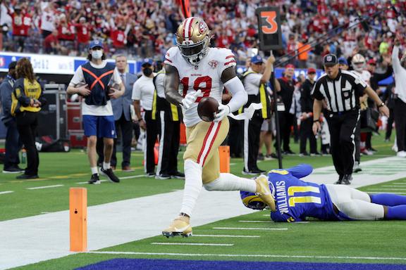 Deebo Samuel #19 of the San Francisco 49ers runs into the end zone for a touchdown in the third quarter against the Los Angeles Rams at SoFi Stadium, in Inglewood, Calif., on Jan. 9, 2022. (Joe Scarnici/Getty Images)
