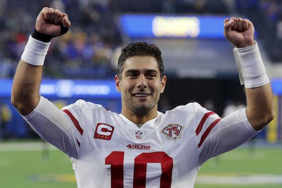 Jimmy Garoppolo #10 of the San Francisco 49ers leaves the field following a 27–24 overtime win over the Los Angeles Rams at SoFi Stadium, in Inglewood, Calif., on Jan. 9, 2022. (Joe Scarnici/Getty Images)