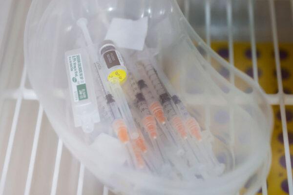 COVID-19 vaccines are seen in a refrigerator at Sydney Road Family Medical Practice in Balgowlah in Sydney, Australia, on Jan. 10, 2022. (Jenny Evans/Getty Images)