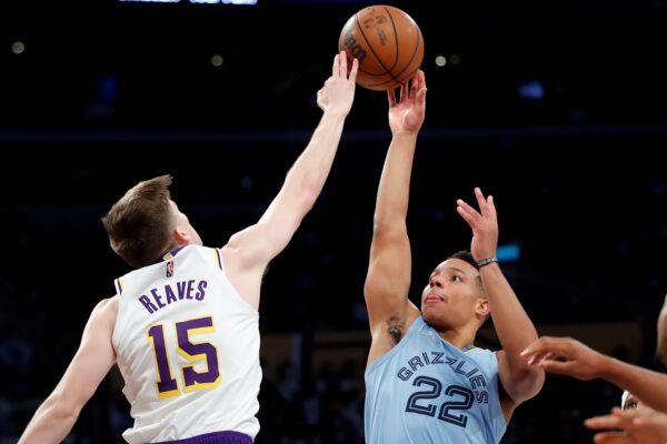 Memphis Grizzlies guard Desmond Bane, right, shoots over Los Angeles Lakers guard Austin Reaves during the first half of an NBA basketball game in Los Angeles, on Jan. 9, 2022. (Alex Gallardo/AP Photo)