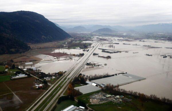 Flooded farms along the Trans-Canada Highway in Abbotsford, B.C., on Nov. 22, 2021. (Darryl Dyck/The Canadian Press)