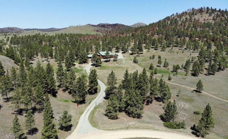The Cooper family property in Montana, consisting of a large home, guest house, and 21 acres for $650,000. (Courtesy of the Cooper family)