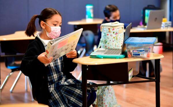 First grade students prepare for class in La Puente, Calif., on Nov. 16, 2020. (Fredric J. Brown/AFP via Getty Images)