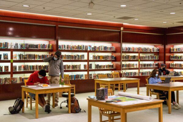 High School students work inside a transformed temporary library at a closed Macy's department store in Burlington, Vt., on March 30, 2021. (JOSEPH PREZIOSO/AFP via Getty Images)