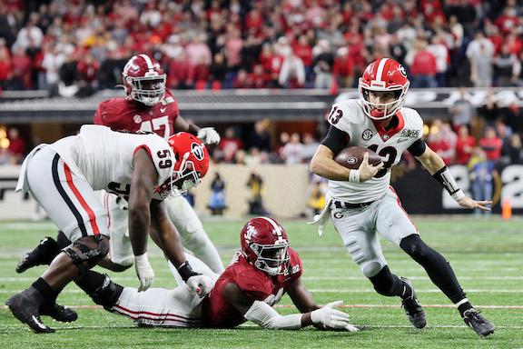 Stetson Bennett #13 of the Georgia Bulldogs runs with the ball in the third quarter of the game against the Alabama Crimson Tide during the 2022 CFP National Championship Game at Lucas Oil Stadium, in Indianapolis, on January 10, 2022. (Andy Lyons/Getty Images)