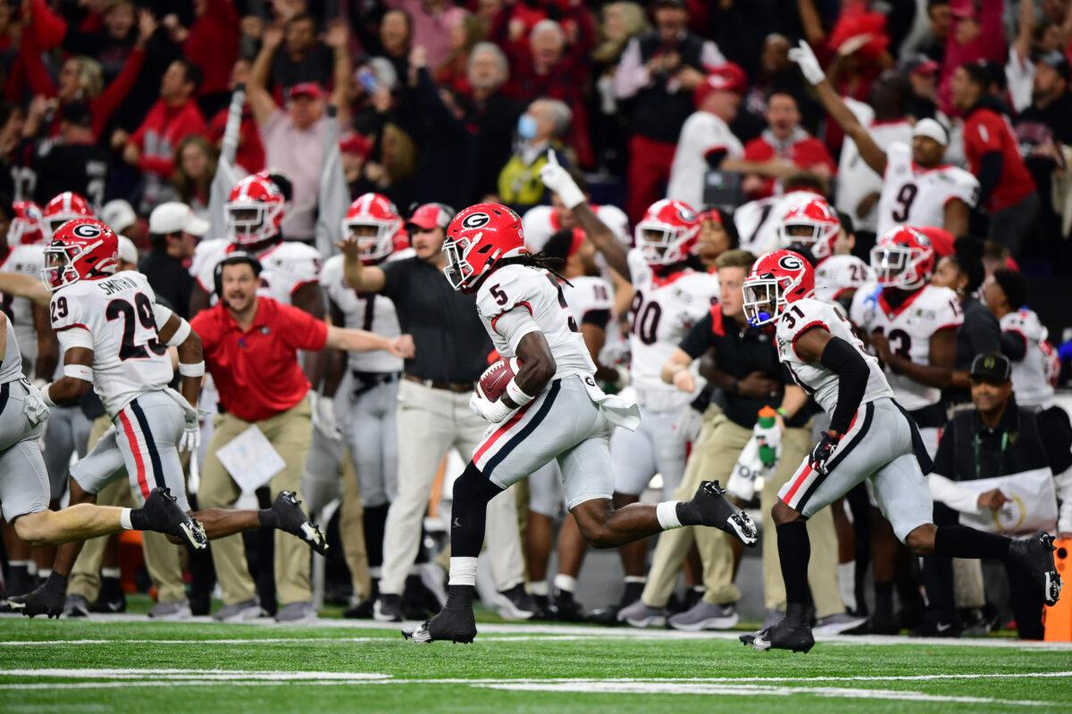 Kelee Ringo #5 of the Georgia Bulldogs carries the ball into the endzone after getting an interception in the fourth quarter of the game against the Alabama Crimson Tide during the 2022 CFP National Championship Game at Lucas Oil Stadium, in Indianapolis, on January 10, 2022. (Emilee Chinn/Getty Images)