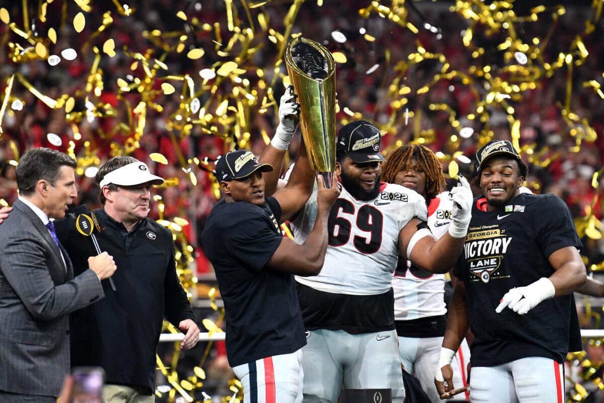 Georgia Bulldogs players celebrate after the Georgia Bulldogs defeated the Alabama Crimson Tide 33-18 in the 2022 CFP National Championship Game at Lucas Oil Stadium, in Indianapolis, on January 10, 2022. (Emilee Chinn/Getty Images)
