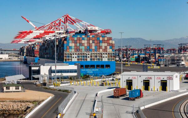 Trucks pick up cargo from the Port of Long Beach in Long Beach, Calif., on Jan. 11, 2022. (John Fredricks/The Epoch Times)