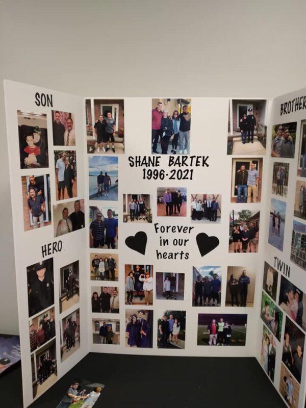 A collage of photographs of family and friends made by Summer Bartek, the twin sister of Shane Bartek was on display at his funeral on Jan. 11, 2022. (Michael Sakal/The Epoch Times).