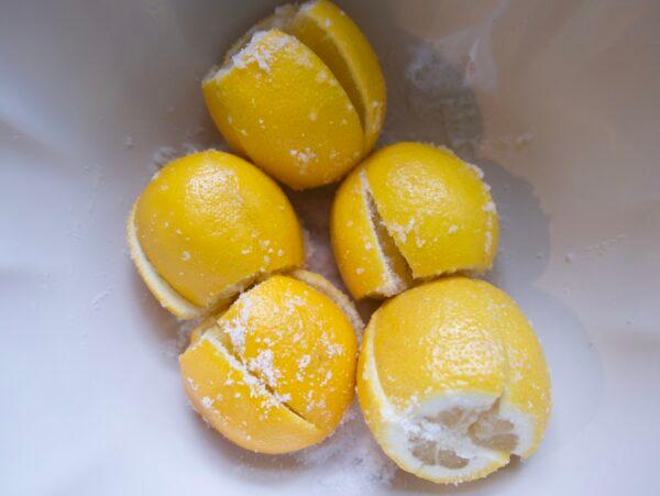 Prep the lemons: Trim, quarter, and pack with salt. (Victoria de la Maza)