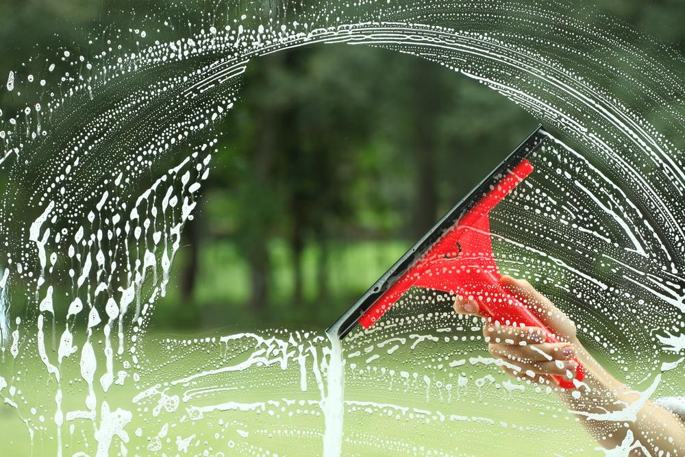 A double-sided squeegee is the best tool for cleaning windows. (Photographee.eu/Shutterstock)