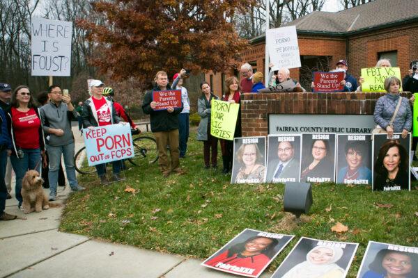 Fairfax County parents and residents protested against a library holiday display featuring the Bible next to Gender Queer and Lawn Boy—the two challenged books returned to Fairfax County school libraries after the Thanksgiving holiday—outside Dolley Madison Public Library in McLean, Va., on Dec. 11, 2021. (Lisa Fan/The Epoch Times)