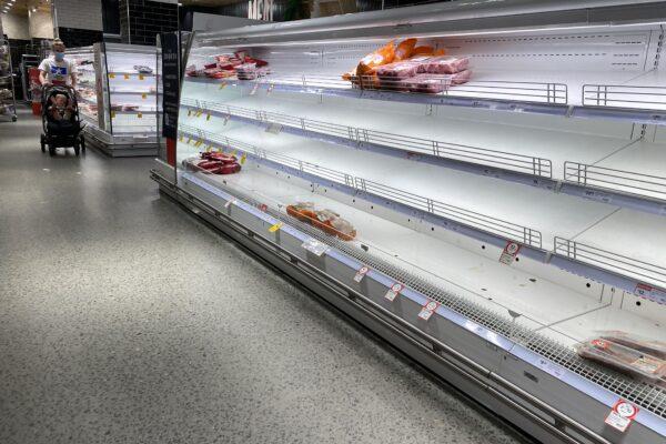 Empty shelves of meat products are seen at a supermarket in Sydney, Australia, on Jan. 7, 2022. (AAP Image/Mick Tsikas)