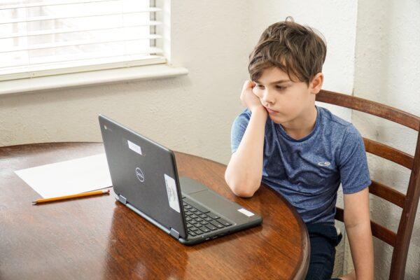 Too much screen time is depriving young boys of the opportunity to develop real world skills, and interpersonal skills. (Thomas Park/Unsplash)