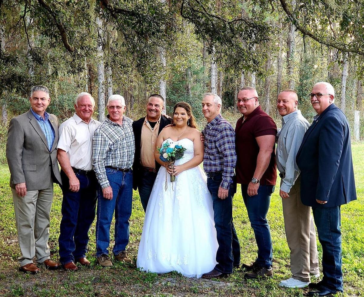 Heather with her father's colleagues on her wedding day. (Courtesy of Florida Highway Patrol)
