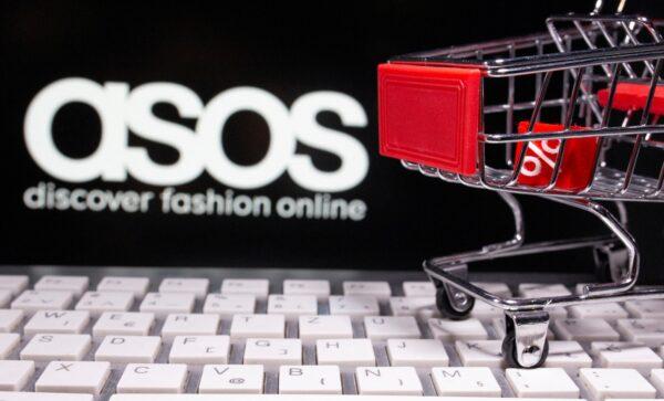 A keyboard and a shopping cart are seen in front of a displayed ASOS logo in this illustration picture taken on Oct. 13, 2020. (Dado Ruvic/Illustration/Reuters)