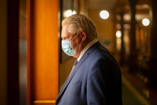 Ontario Premier Doug Ford walks to his office in the Ontario legislature building in Toronto on June 14, 2021. (The Canadian Press/Chris Young)
