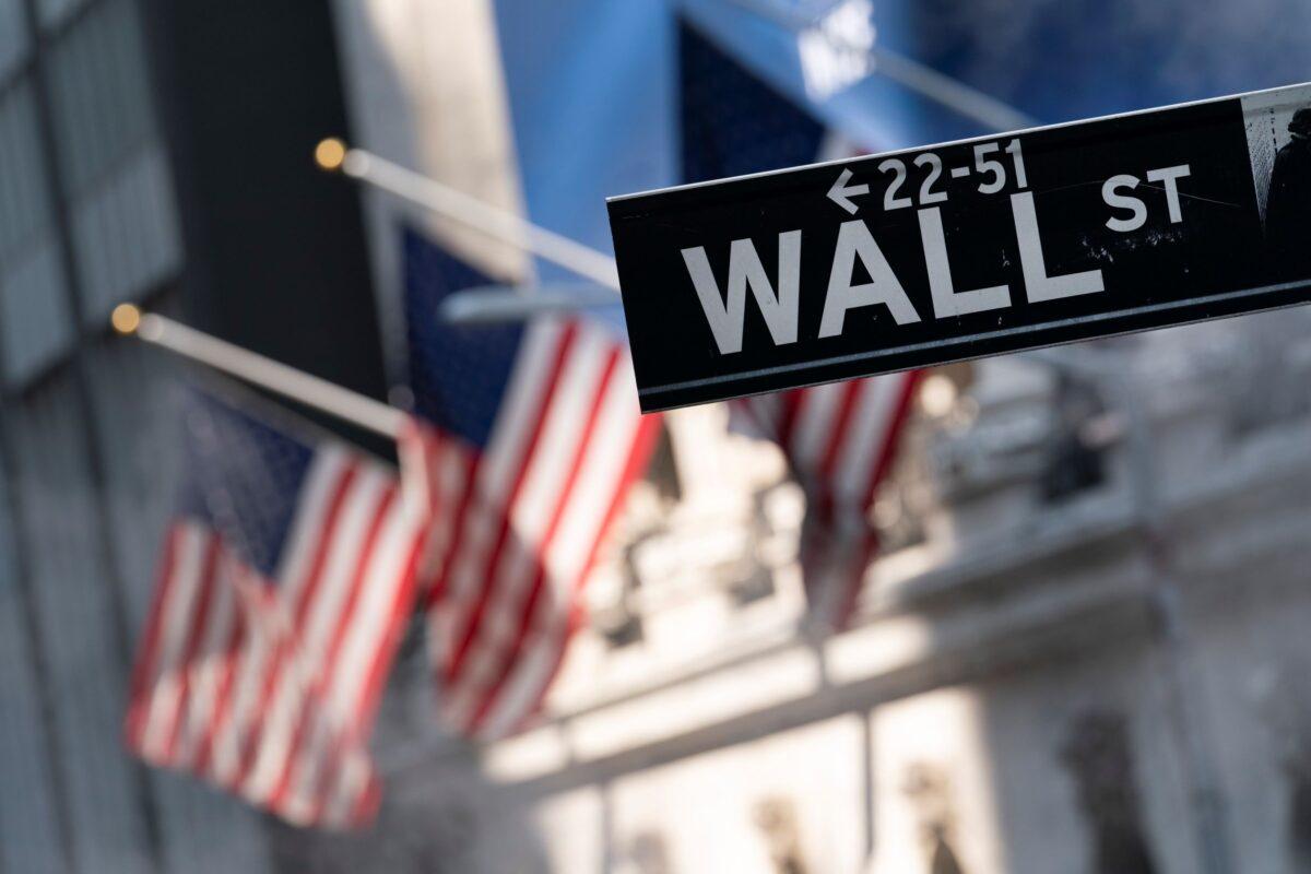 A sign for Wall Street hangs in front of the New York Stock Exchange, on July 8, 2021. (Mark Lennihan/AP Photo)